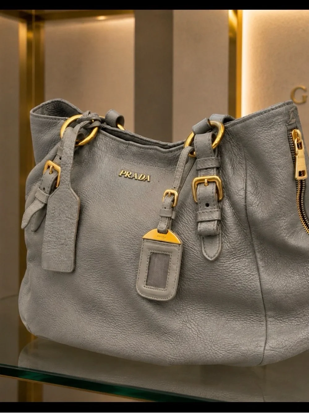 AUTHENTIC PRADA GUNMETAL & SHEEN DEERSKIN LEATHER SHOULDER BAG W/LUGGAGE TAG.